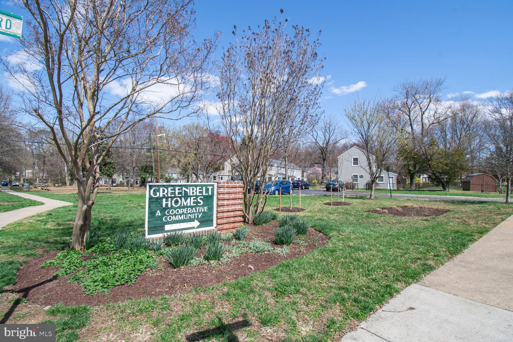 36 Ridge Road Greenbelt, MD 20770 - Photo 7 of 27 a sign board with tall trees in the background