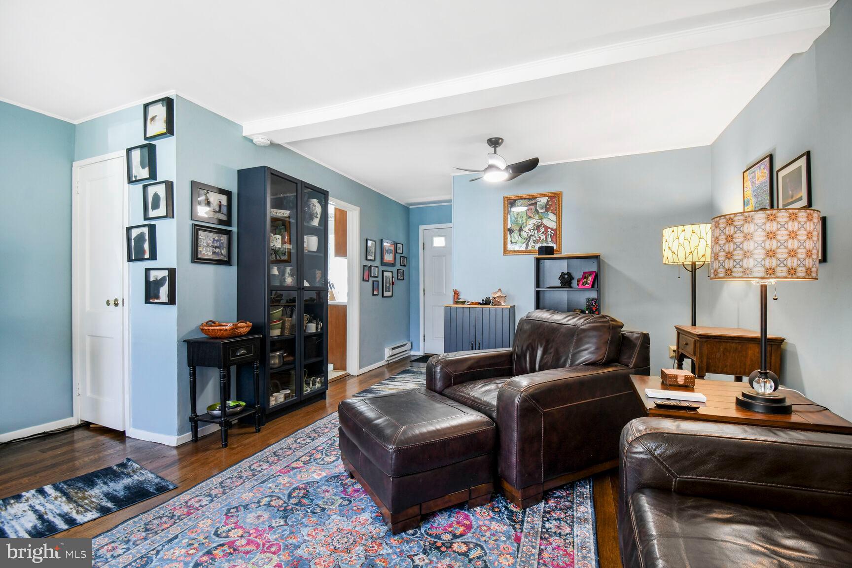 36 Ridge Road Greenbelt, MD 20770 - Photo 8 of 27 a living room with furniture and a lamp