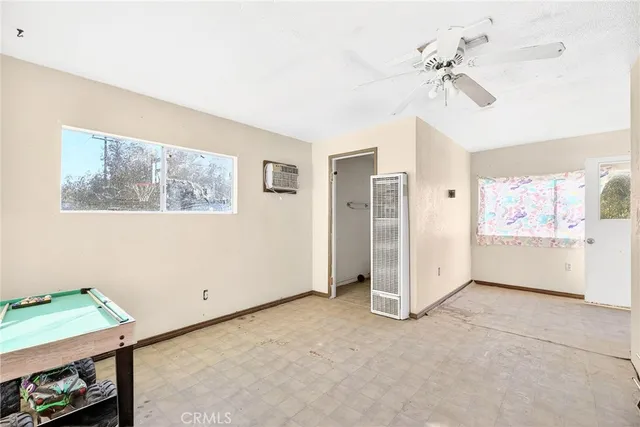 a view of a room with workspace and window