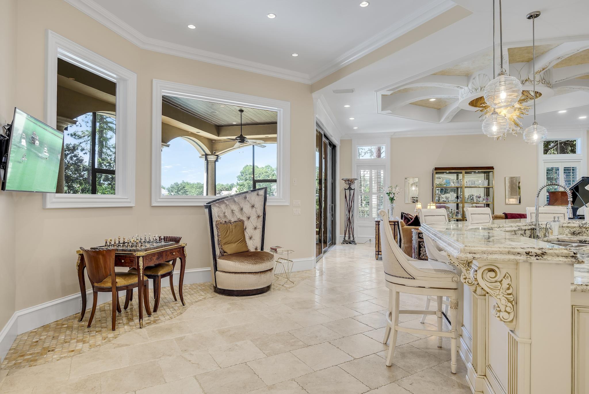 2902 Pine Valley Road Miramar Beach, FL 32550 - Photo 15 of 89 a living room with furniture a ceiling fan and a window