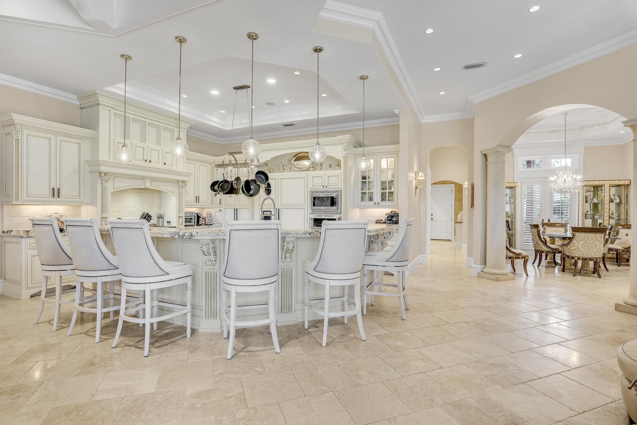 2902 Pine Valley Road Miramar Beach, FL 32550 - Photo 17 of 89 a large kitchen with a dining table chairs and large window
