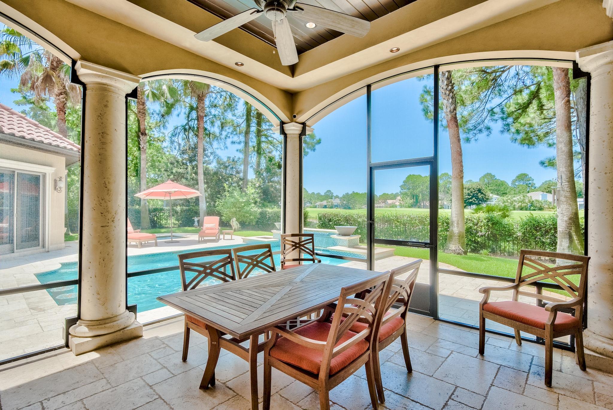 2902 Pine Valley Road Miramar Beach, FL 32550 - Photo 24 of 89 a view of a patio with a table and chairs