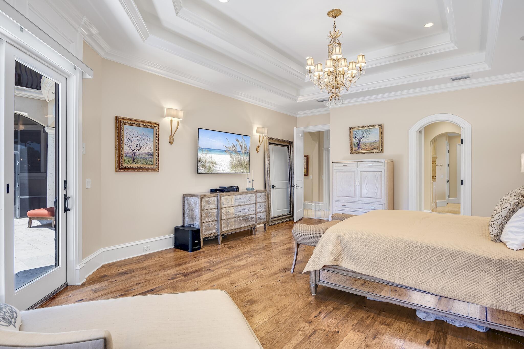 2902 Pine Valley Road Miramar Beach, FL 32550 - Photo 27 of 89 a bedroom with a bed chandelier and a window