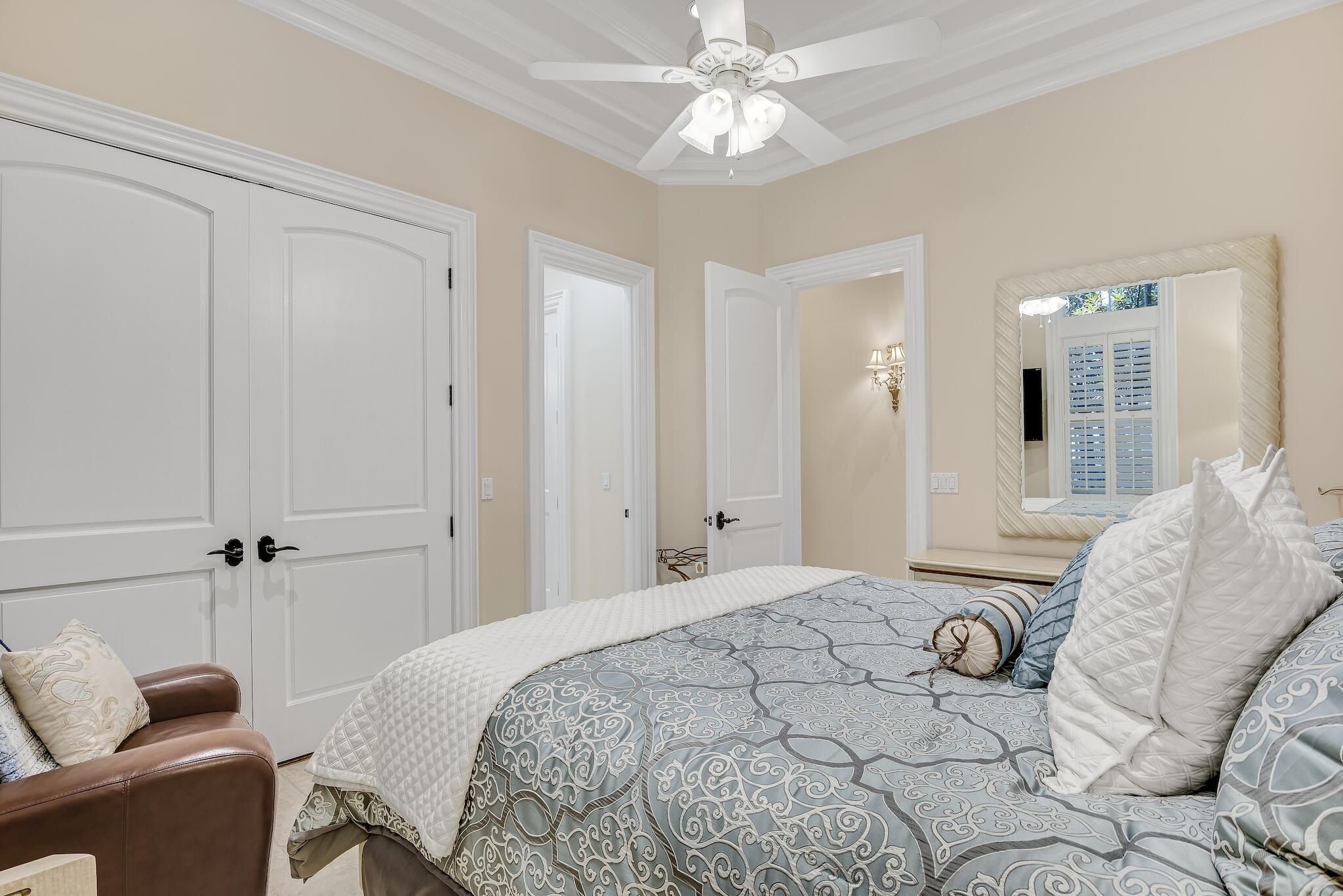 2902 Pine Valley Road Miramar Beach, FL 32550 - Photo 36 of 89 a bedroom with a bed and a chandelier
