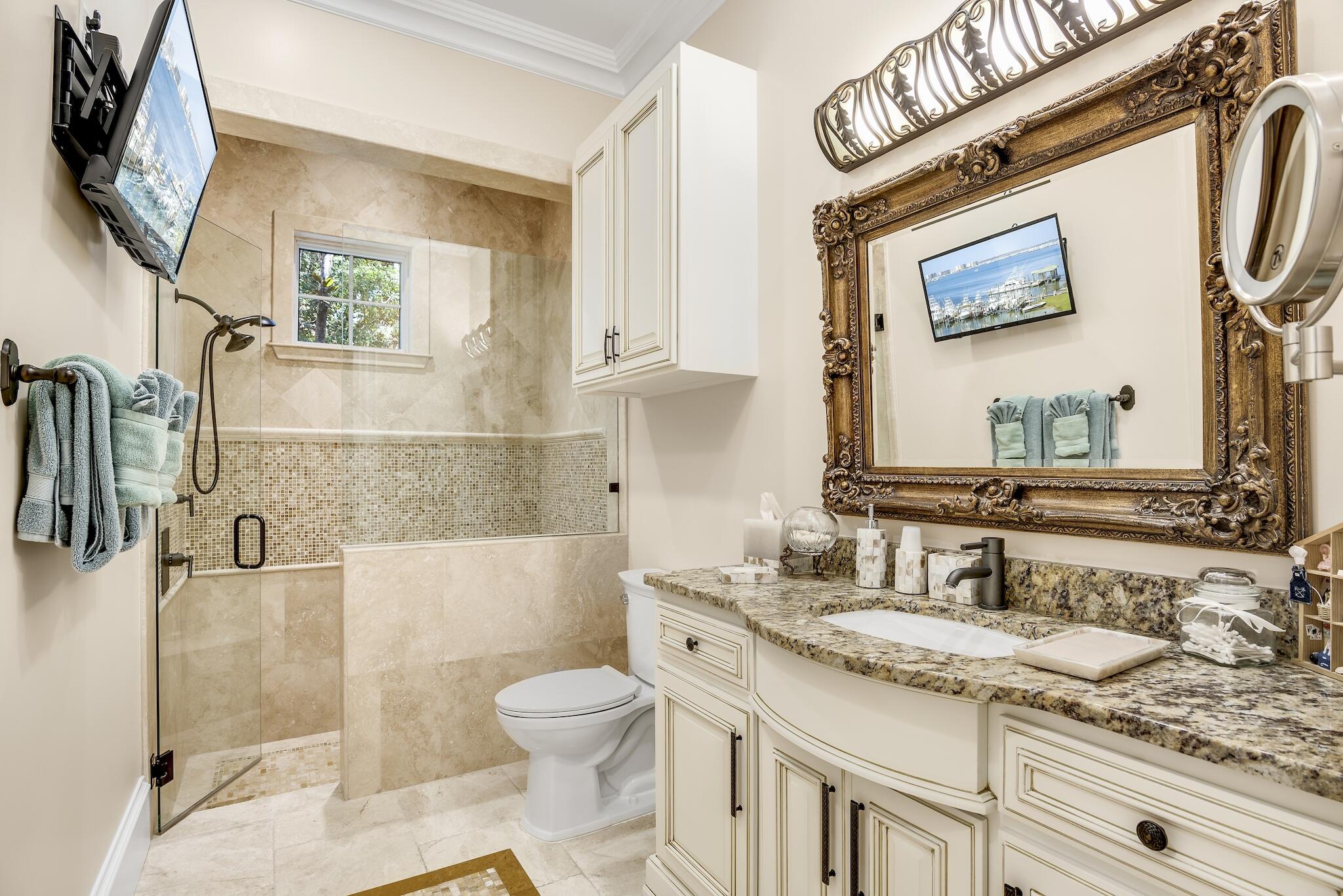 2902 Pine Valley Road Miramar Beach, FL 32550 - Photo 37 of 89 a bathroom with a granite countertop sink toilet and shower
