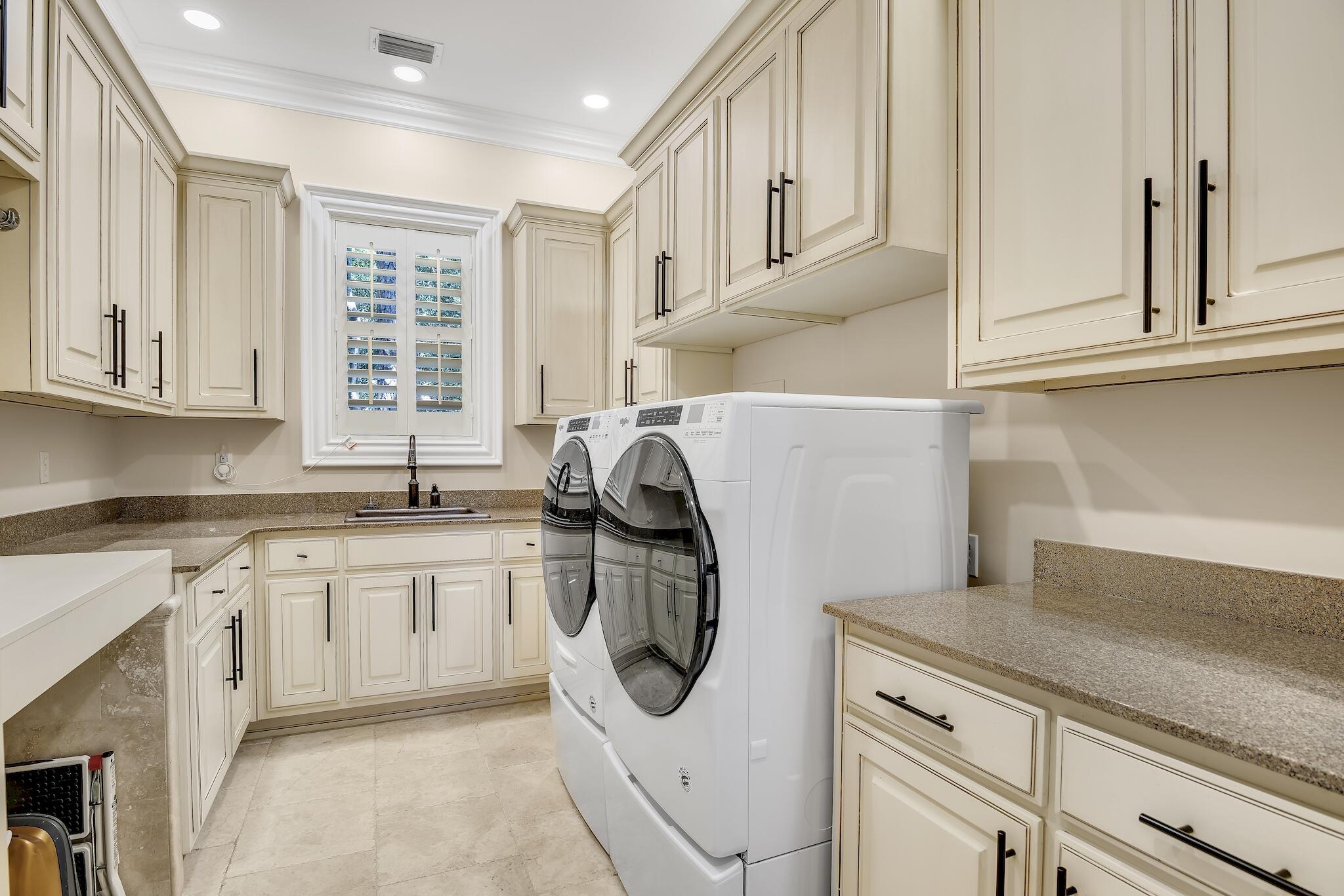 2902 Pine Valley Road Miramar Beach, FL 32550 - Photo 39 of 89 a kitchen with stainless steel appliances granite countertop a sink and cabinets with wooden floor