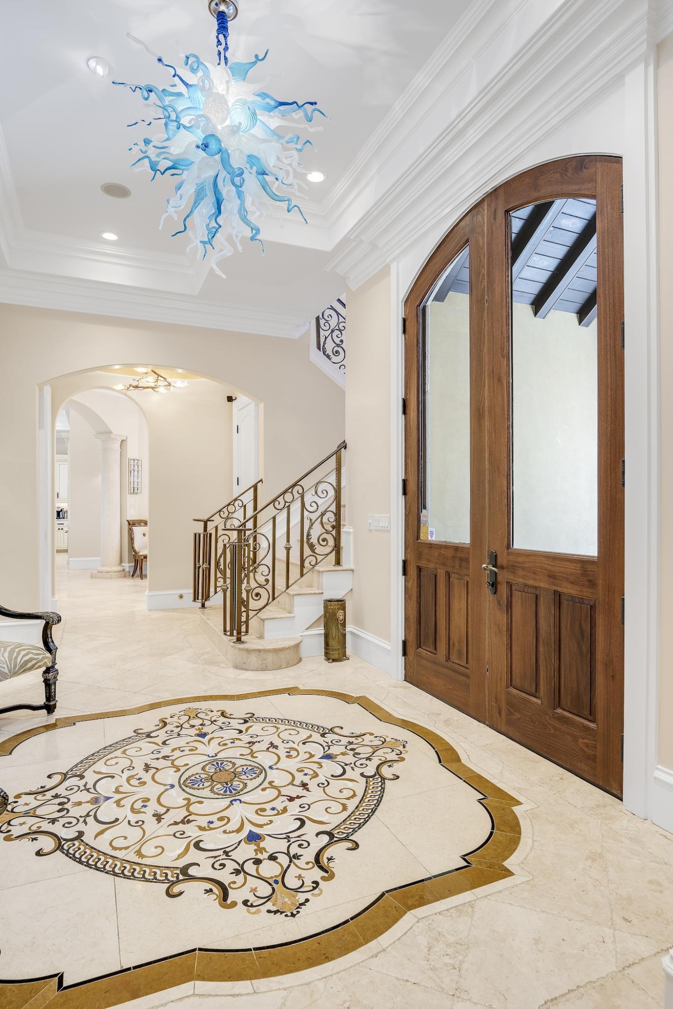 2902 Pine Valley Road Miramar Beach, FL 32550 - Photo 10 of 89 a view of a hallway with a dining table and a chandelier