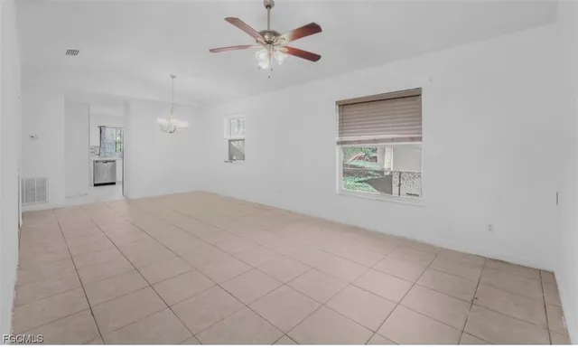 wooden floor in a gallery with a chandelier fan