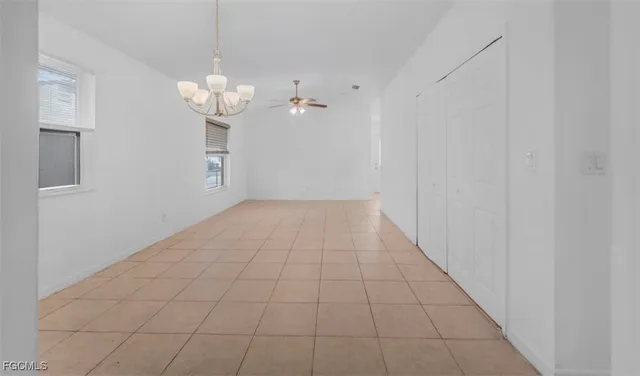 a kitchen with white cabinets stainless steel appliances and sink