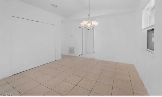 a kitchen with white cabinets stainless steel appliances and sink