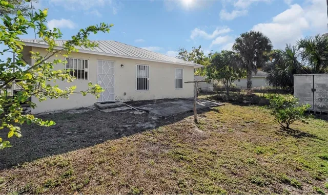 an aerial view of houses with yard
