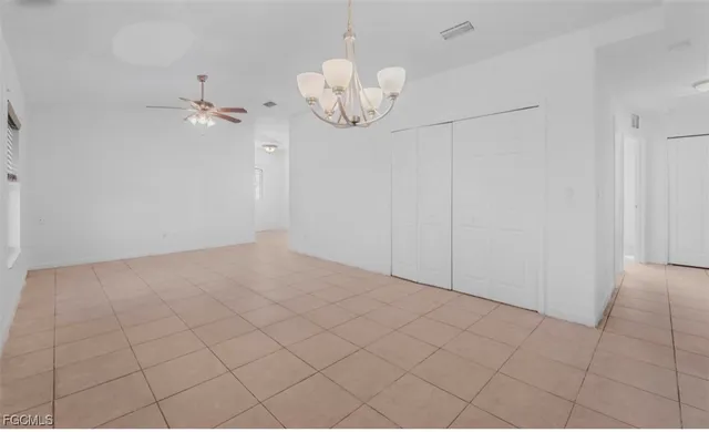 a view of an empty room with closet