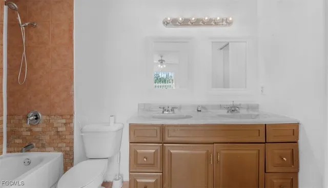 a bathroom with a sink a mirror and shower