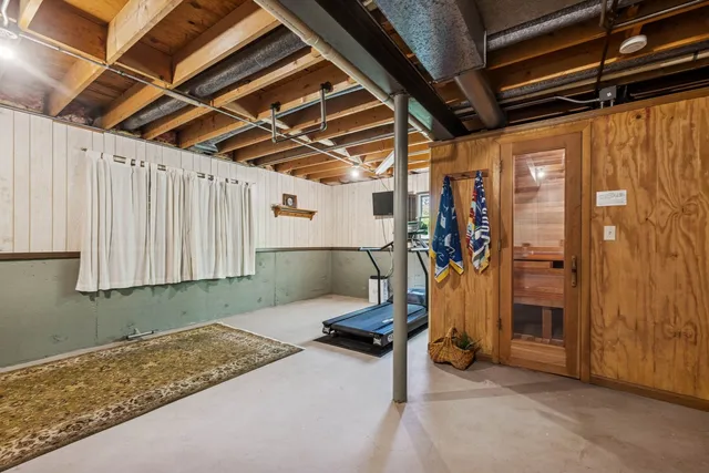 a view of a room with wooden walls