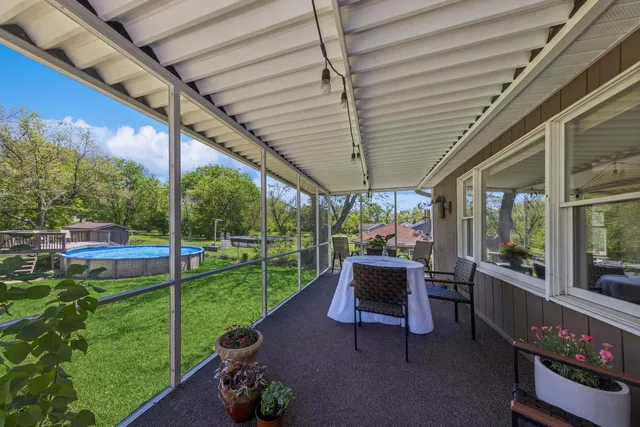a building outdoor space with patio furniture and garden