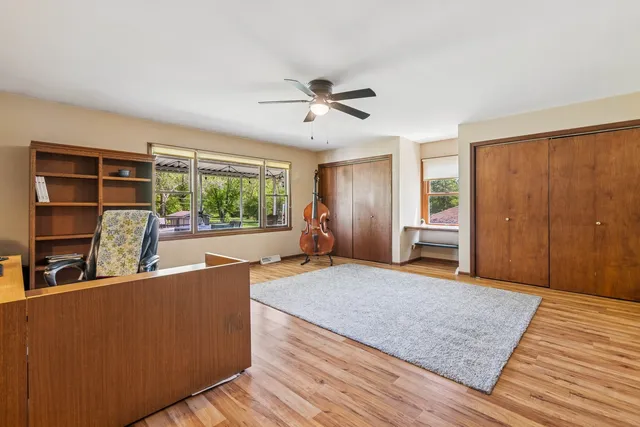 a living room with hard wood floors and a window