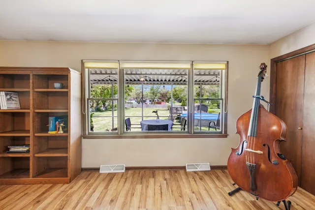 a room with wooden floor and furniture