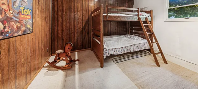 a bedroom with a bed and a table in it