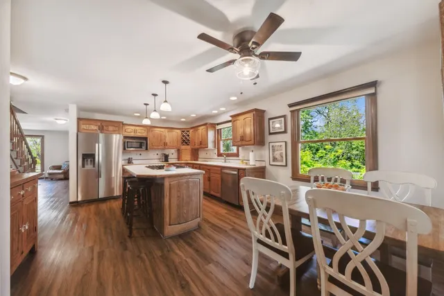 a view of a dining room with furniture window and wooden floor