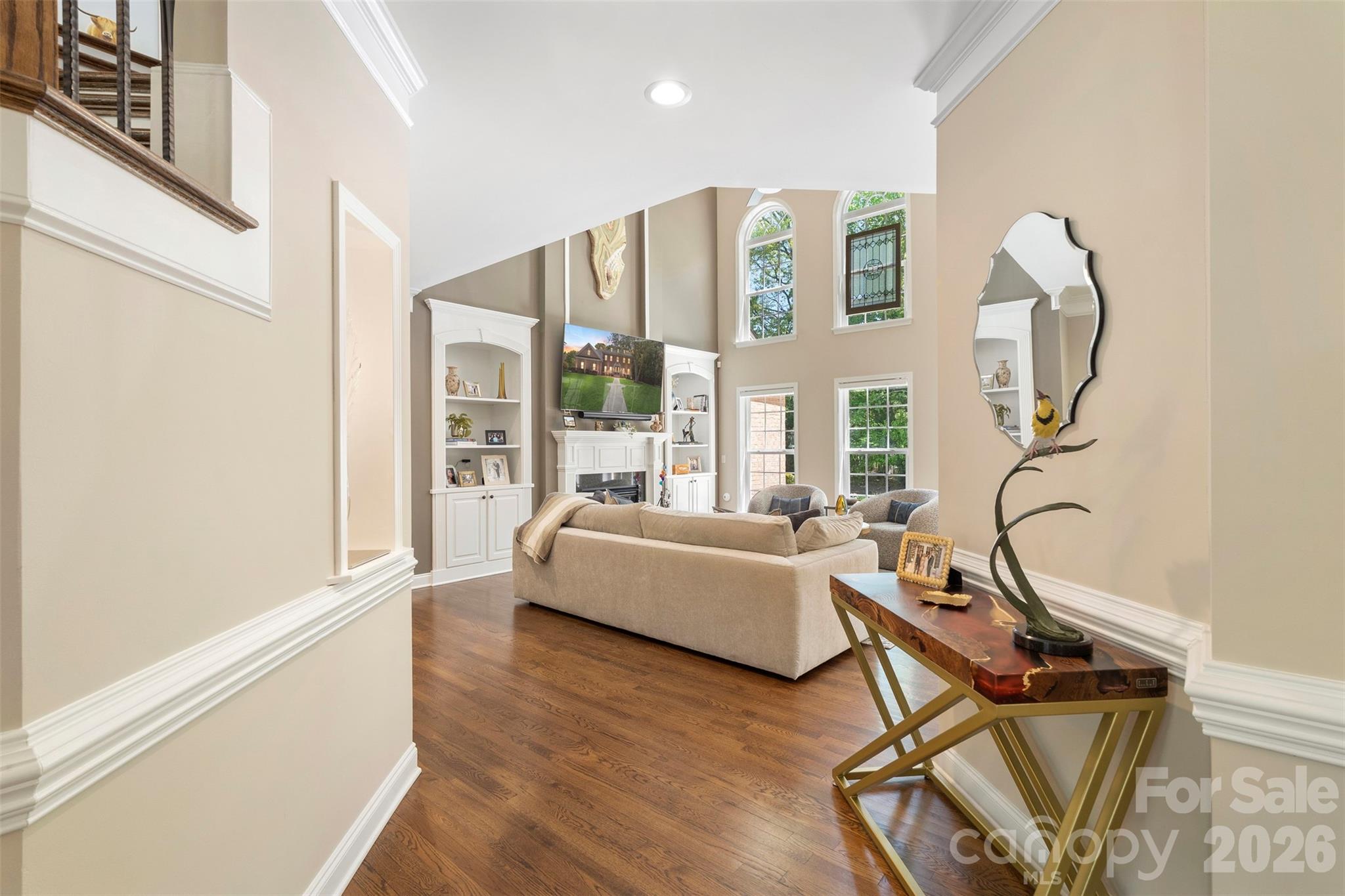 2003 Bauer Place Waxhaw, NC 28173 - Photo 12 of 47 a living room with furniture a fireplace and a floor to ceiling window