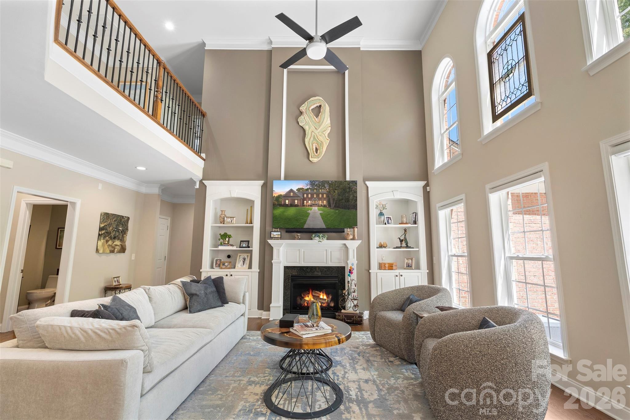 2003 Bauer Place Waxhaw, NC 28173 - Photo 13 of 47 a living room with furniture a fireplace and a large window