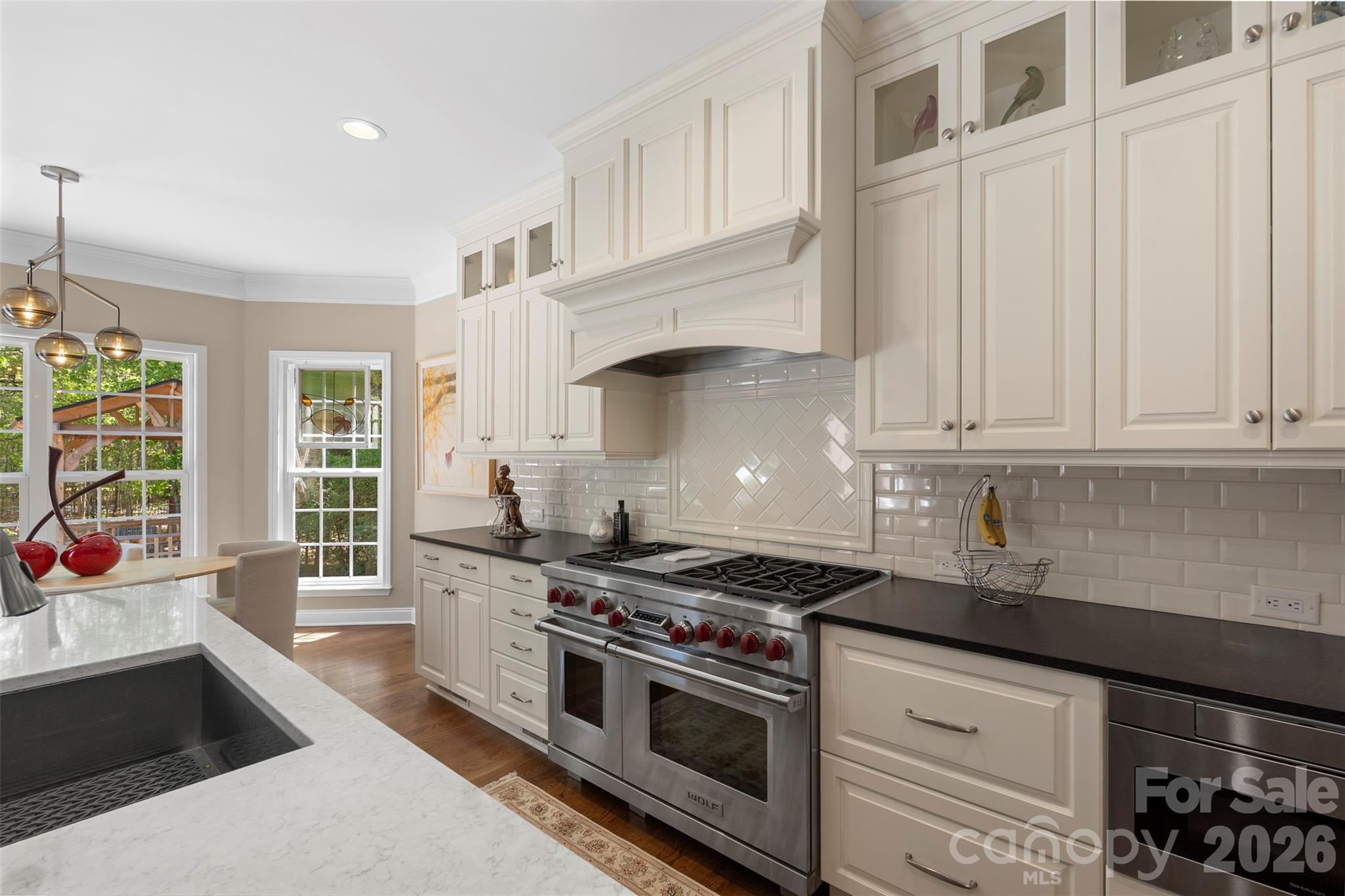 2003 Bauer Place Waxhaw, NC 28173 - Photo 19 of 47 a kitchen with stainless steel appliances granite countertop a stove and a sink