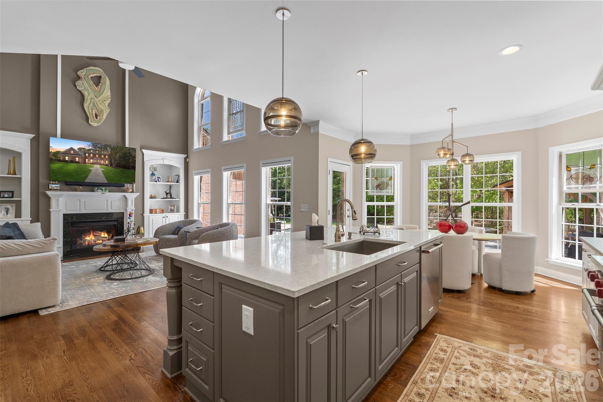 2003 Bauer Place Waxhaw, NC 28173 - Photo 20 of 47 a large kitchen with kitchen island a large counter space a sink appliances and a large window