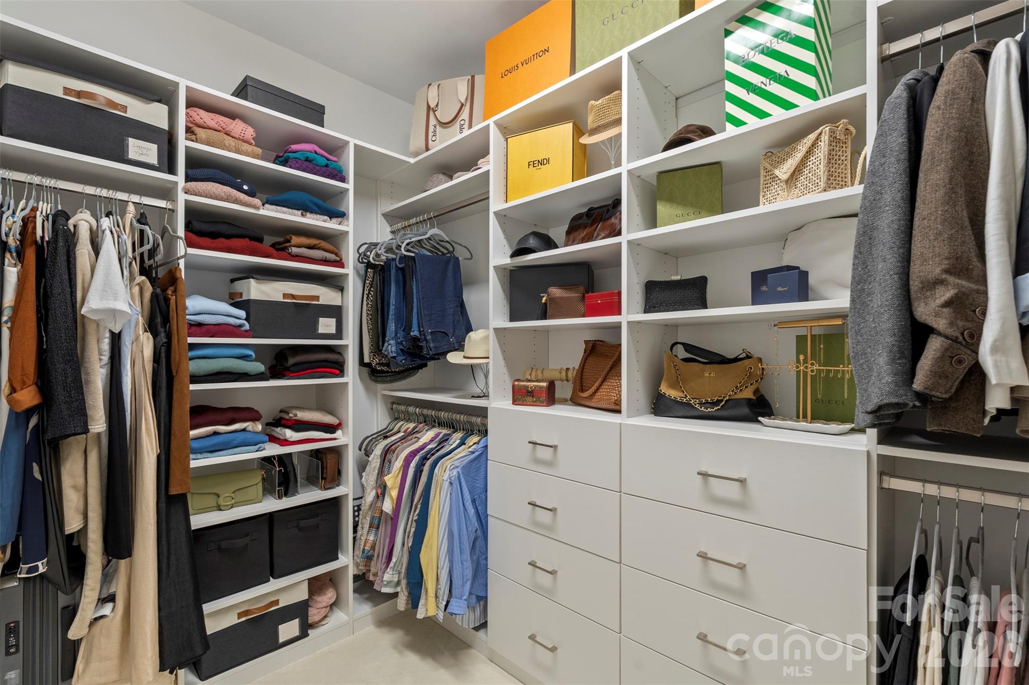 2003 Bauer Place Waxhaw, NC 28173 - Photo 28 of 47 a view of walk in closet with clothes and shoes