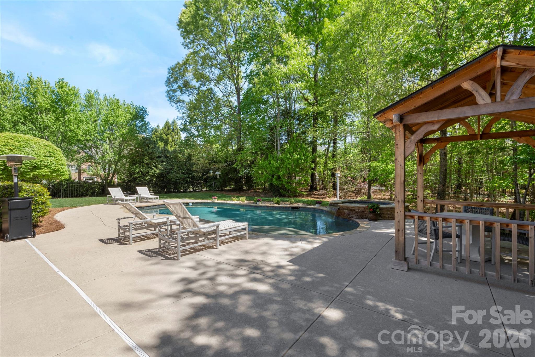 2003 Bauer Place Waxhaw, NC 28173 - Photo 38 of 47 a view of a patio with a table chairs and a backyard