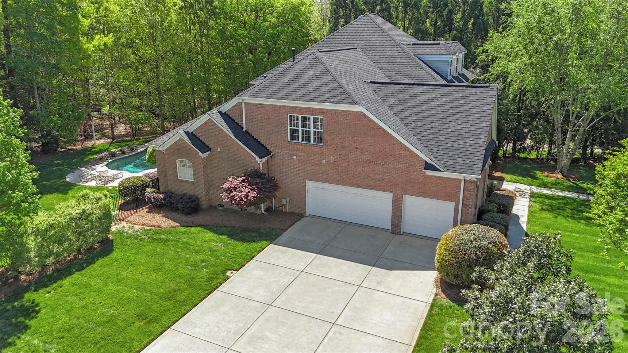 2003 Bauer Place Waxhaw, NC 28173 - Photo 46 of 47 a backyard of a house with lots of green space