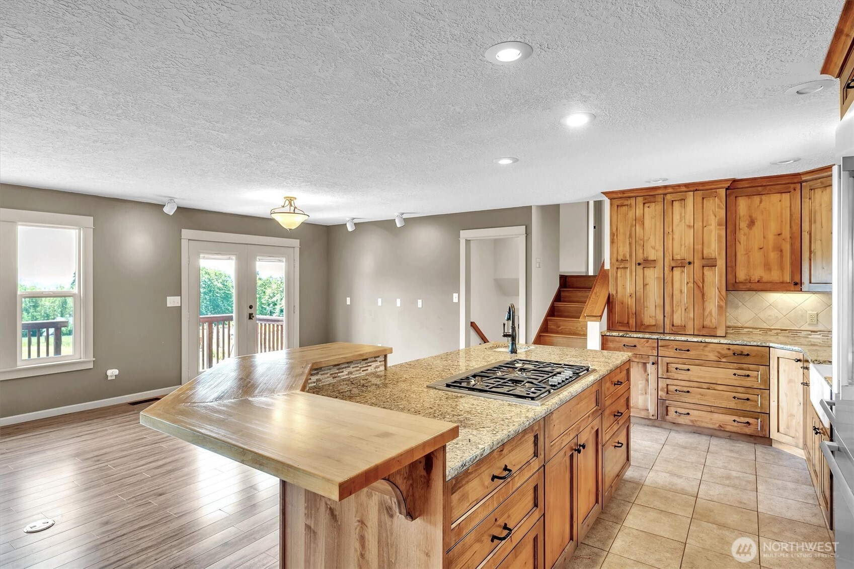 231 Robertson Road Longview, WA 98632 - Photo 11 of 37 a kitchen with kitchen island granite countertop a stove and a sink