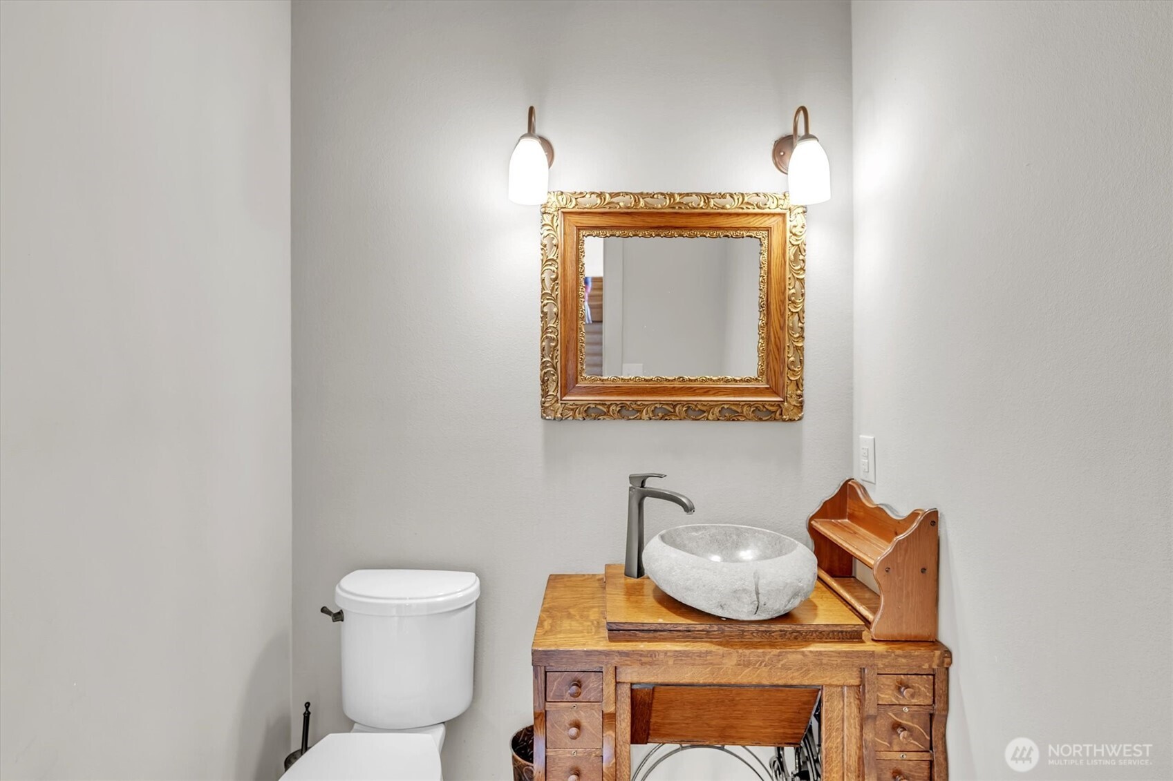231 Robertson Road Longview, WA 98632 - Photo 15 of 37 a bathroom with a toilet mirror and vanity