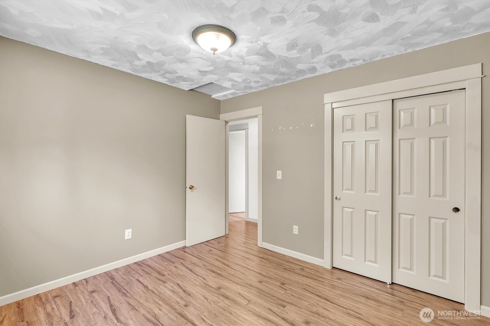 231 Robertson Road Longview, WA 98632 - Photo 22 of 37 an empty room with wooden floor and windows