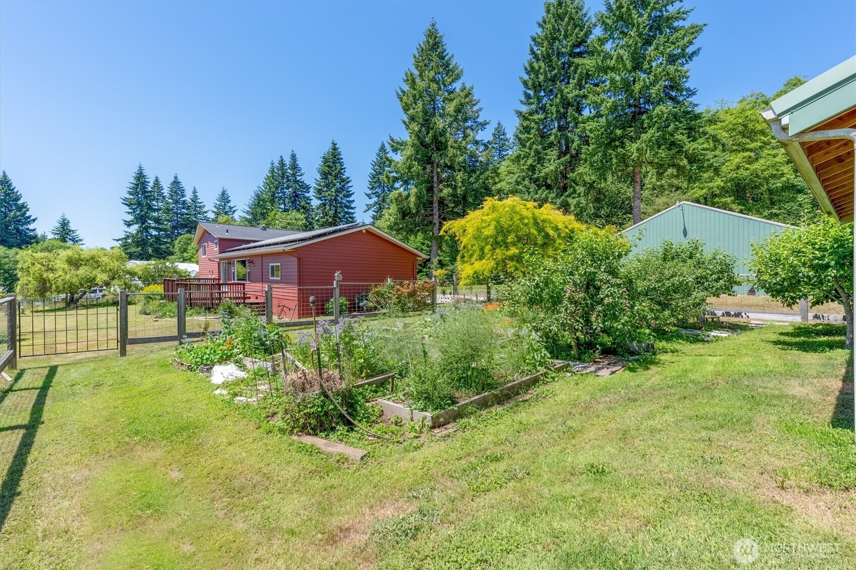 231 Robertson Road Longview, WA 98632 - Photo 33 of 37 a view of a house with a yard and potted plants