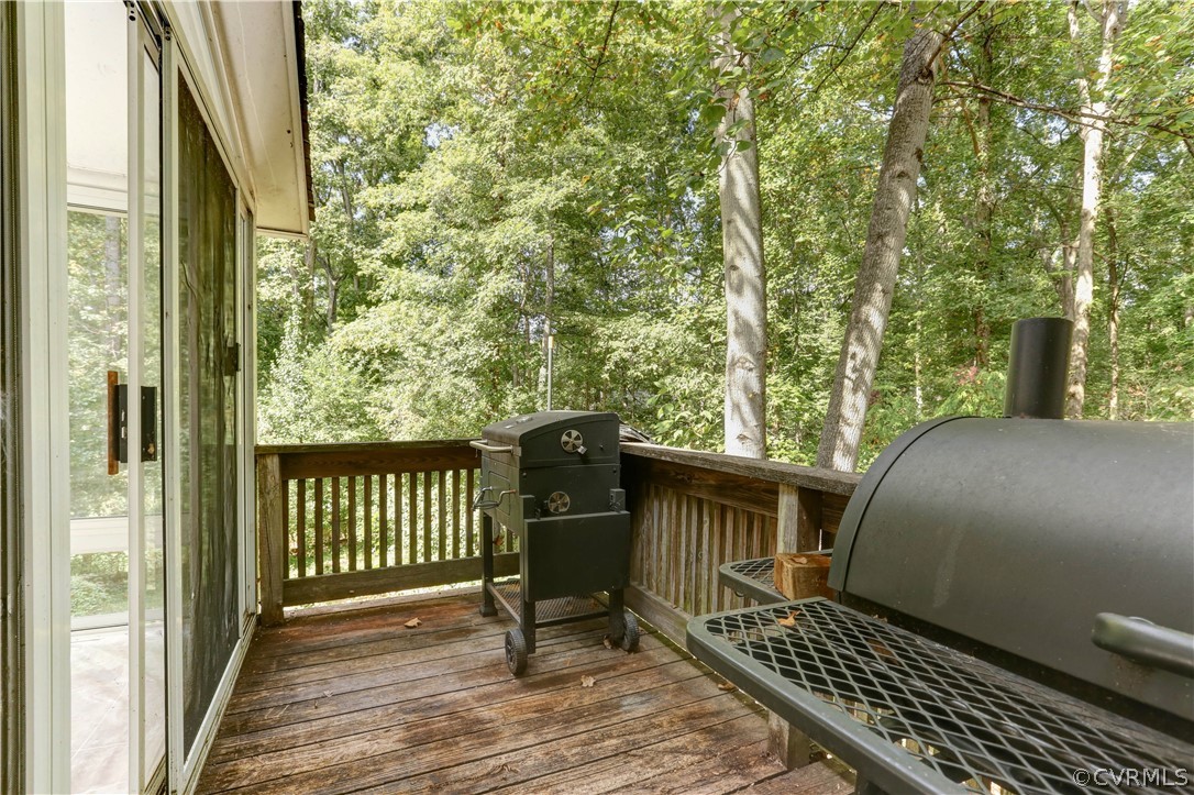 13818 Sutters Mill Road Midlothian, VA 23112 - Photo 23 of 37 a view of a balcony with wooden floor and fence