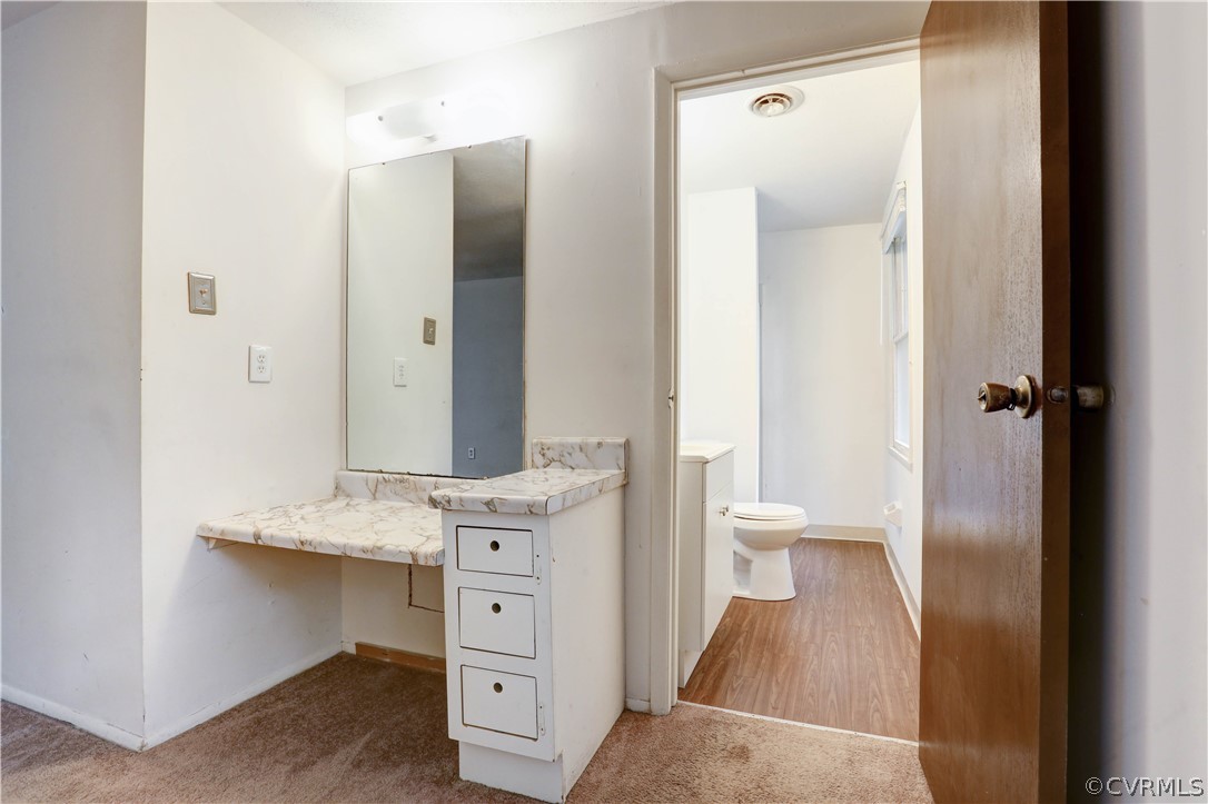 13818 Sutters Mill Road Midlothian, VA 23112 - Photo 34 of 37 a view of bathroom with a toilet sink and mirror