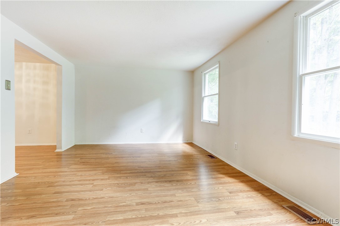 13818 Sutters Mill Road Midlothian, VA 23112 - Photo 8 of 37 a view of an empty room with wooden floor and a window