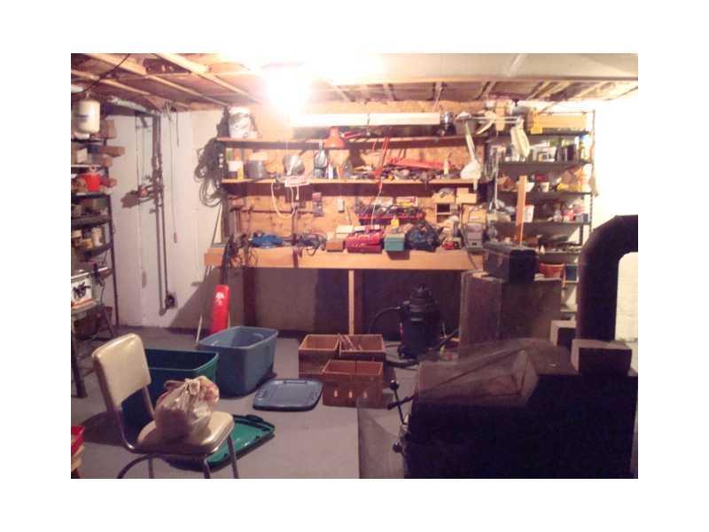 32 Merrill Road Gray, ME 04039 - Photo 11 of 13 Other. workshop with woodstove tools...
