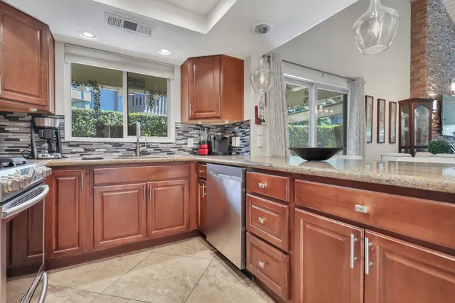a bedroom with a bed a couch and dresser