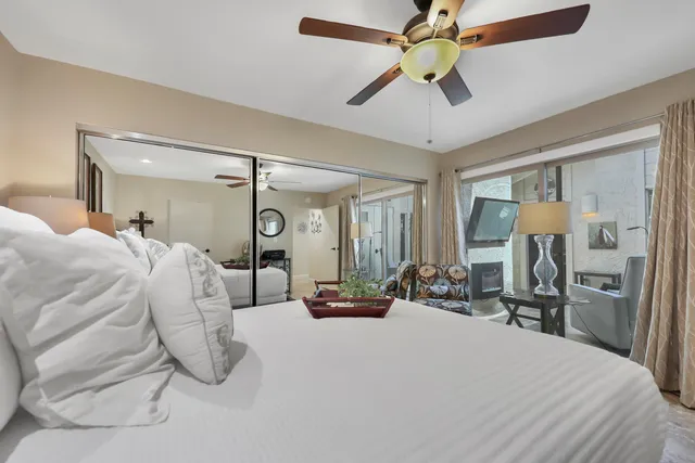 a bathroom with a double vanity sink mirror and shower