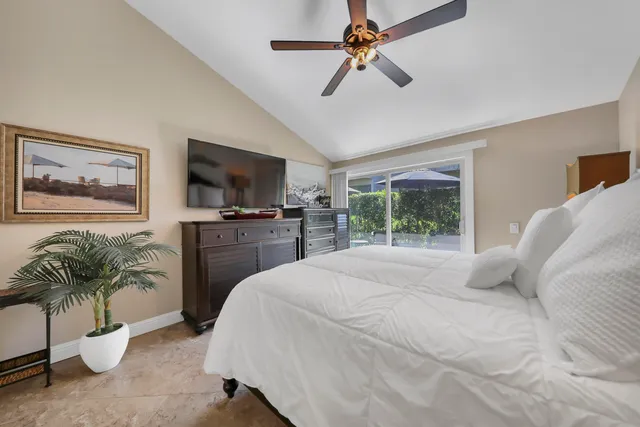 a bathroom with a granite countertop sink mirror and bathtub