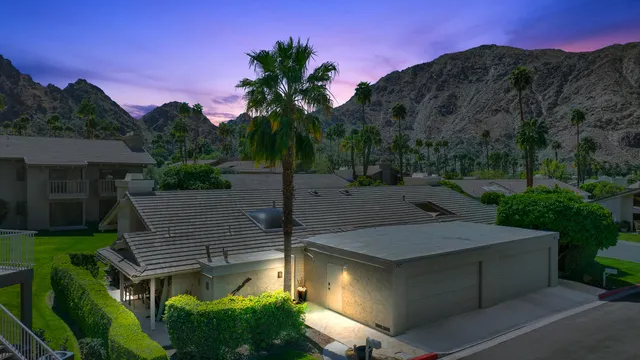 a view of a patio with chairs and a table with chairs