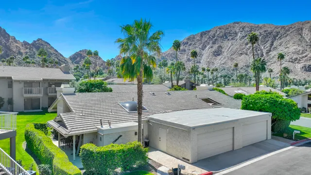 a view of a dinning table and chairs in patio