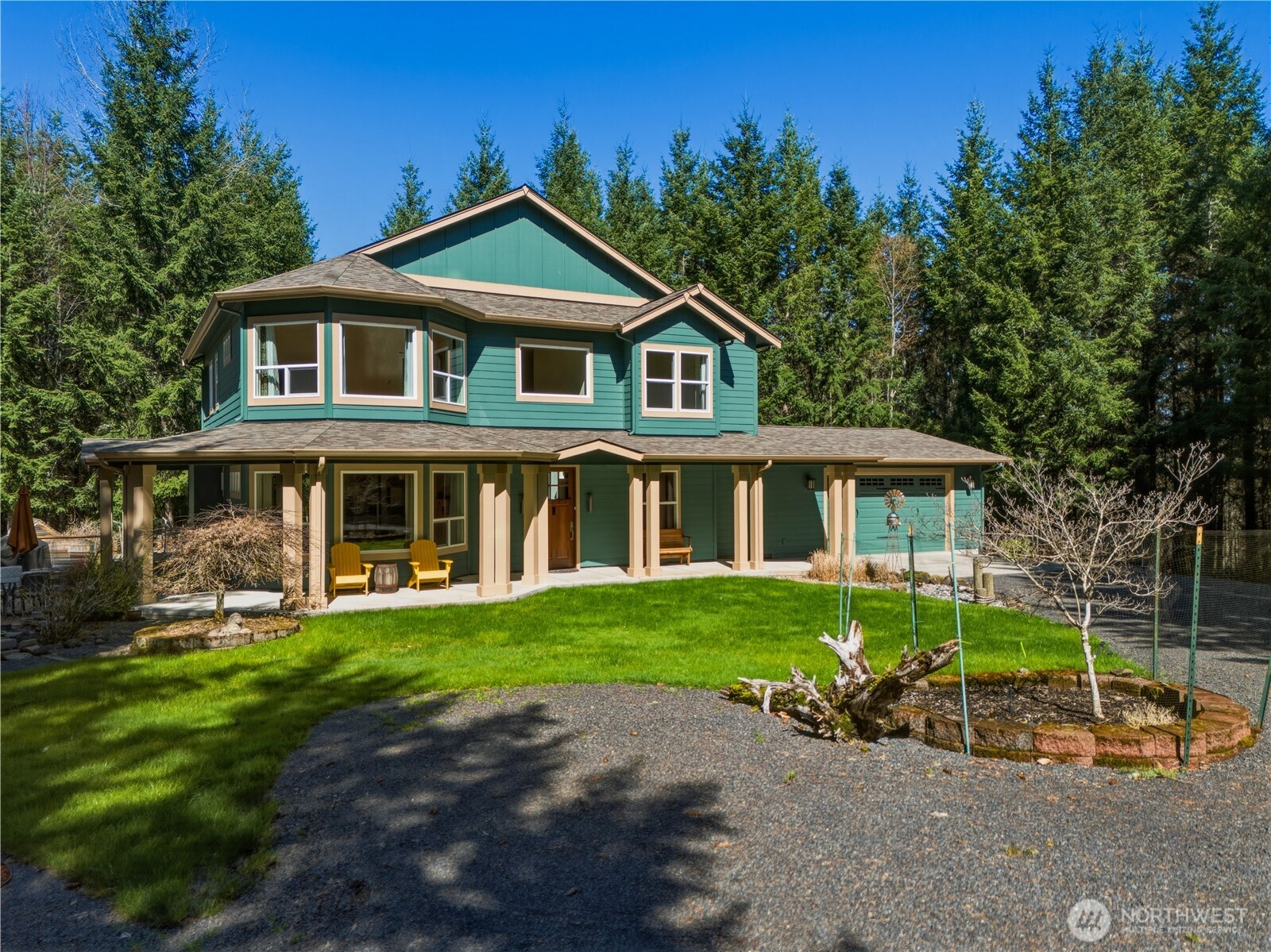 418 Shy Bear Road Toutle, WA 98649 - Photo 1 of 40 a front view of a house with a garden