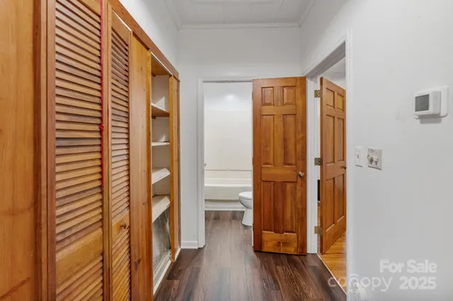 a view of front door with wooden floor