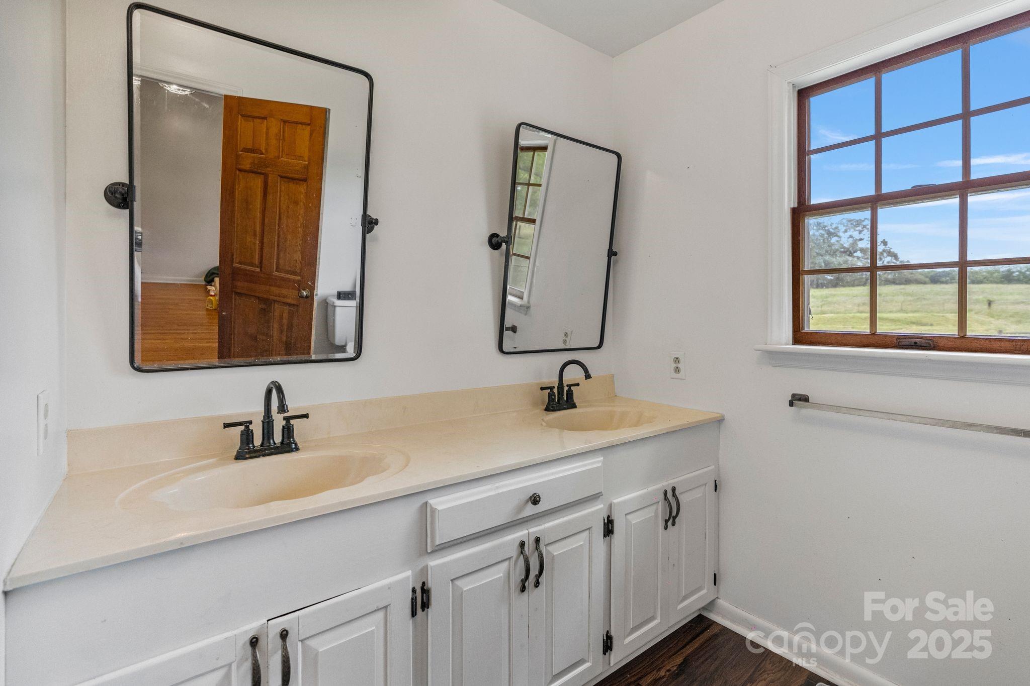 956 Stoney Point Road Kings Mountain, NC 28086 - Photo 16 of 48 a bathroom with a sink and a mirror