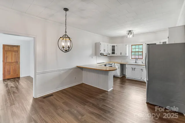 a kitchen with a refrigerator a sink and dishwasher