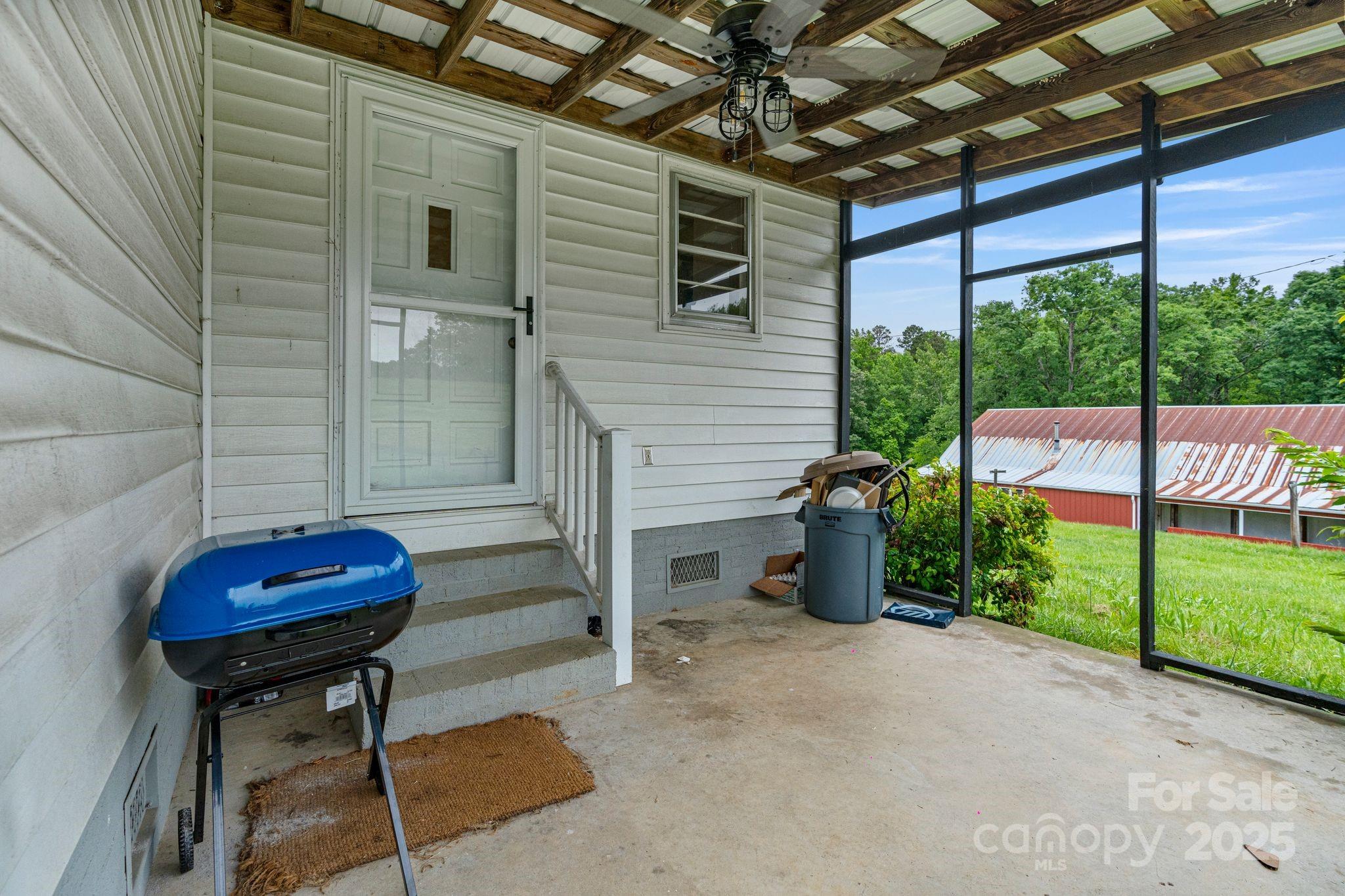 956 Stoney Point Road Kings Mountain, NC 28086 - Photo 28 of 48 a view of a porch with furniture and a backyard