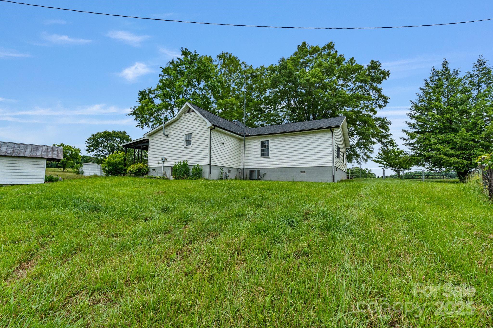 956 Stoney Point Road Kings Mountain, NC 28086 - Photo 31 of 48 a house with green field in front of it