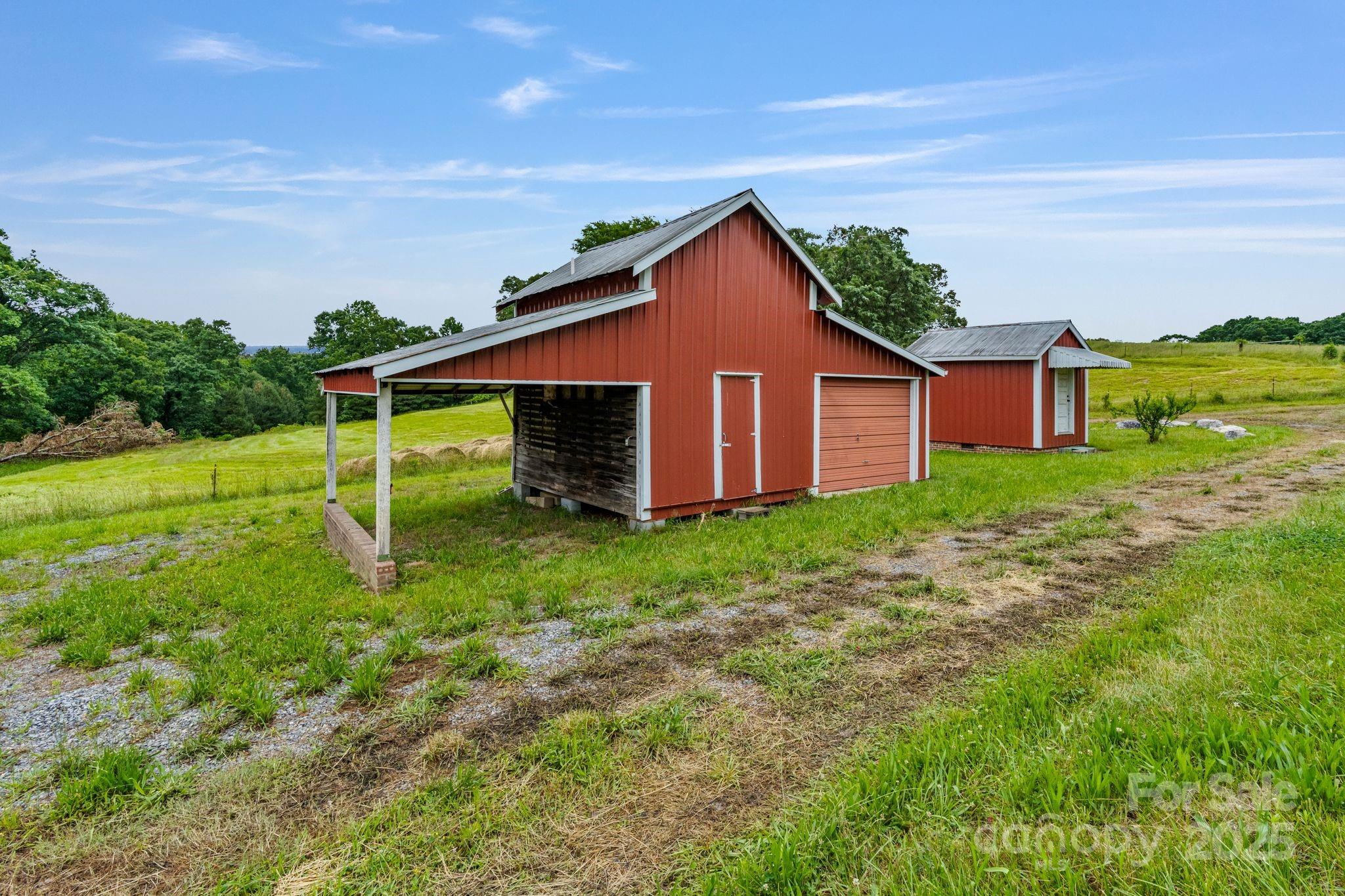 956 Stoney Point Road Kings Mountain, NC 28086 - Photo 33 of 48 a view of a backyard with potted plants and large tree
